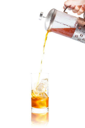 Coffee clod brew process (Method) by French press. Fill-pouring iced americano into a glass of water with iced.  Isolated on white background with clipping path.の写真素材