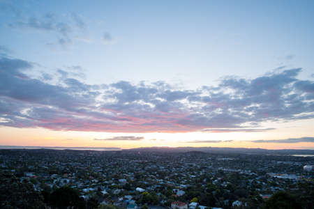 Beautiful View of a town in Auckland, New Zealand. Cloud sunset and town, View from Mt. Eden.の写真素材