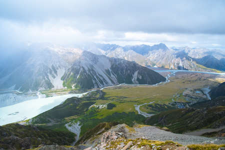 Beautiful scene green nature and rocky mountain with glacier over the Mt Cook National park (Muller hut track)の写真素材