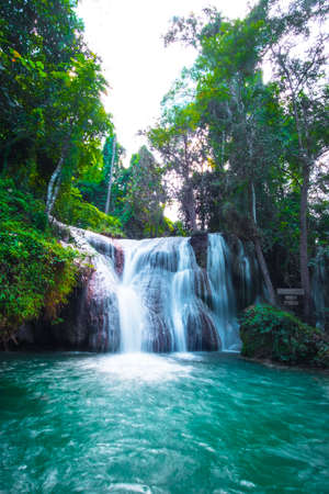 Than sawan Waterfall, Payao, Thailand, Long explosure shot, Beautiful green waterfall in the nature at sunset.の写真素材