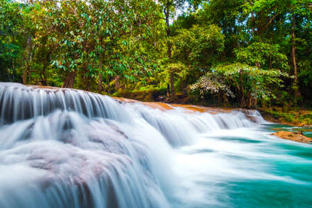 Than sawan Waterfall, Payao, Thailand, Long explosure shot, Beautiful green waterfall in the nature at sunset.の写真素材