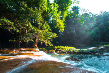 Than sawan Waterfall, Payao, Thailand, Long explosure shot, Beautiful green waterfall in the nature at sunset.
の写真素材