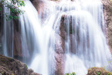 Than sawan Waterfall, Payao, Thailand, Long explosure shot, Close up, Beautiful green waterfall in the nature at sunset.の写真素材