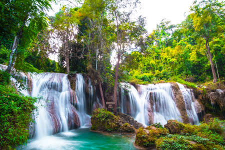 Than sawan Waterfall, Payao, Thailand, Long explosure shot, Beautiful green waterfall in the nature at sunset.の写真素材