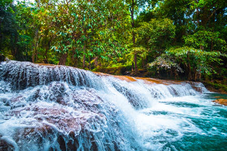 Than sawan Waterfall, Payao, Thailand, Normal shot, Beautiful green waterfall in the nature at sunset.の写真素材