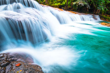 Than sawan Waterfall, Payao, Thailand, Long explosure shot, Beautiful green waterfall in the nature at sunset.の写真素材