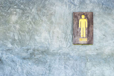 Toilet sign, symbol, made by old wooden paint by yellow color.の写真素材