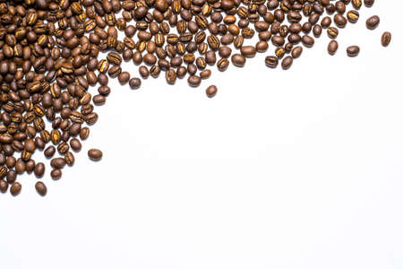 Flay lay style, Medium dark Roasted peaberry coffee beans isolated on white background with copy space for text.の写真素材