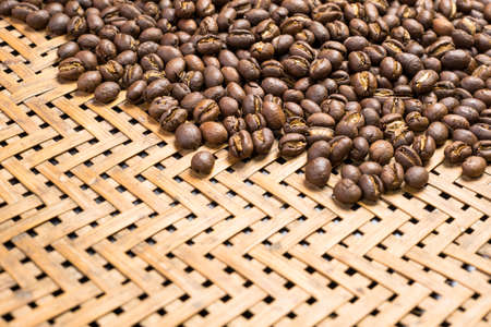 Depth of field shot, soft focus, Medium dark Roasted peaberry coffee beans background with copy space. の写真素材
