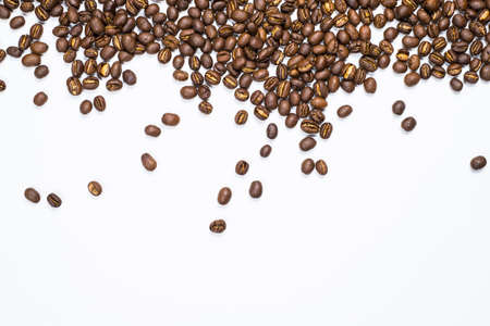 Flay lay style, Medium dark Roasted peaberry coffee beans isolated on white background with copy space for text.の写真素材
