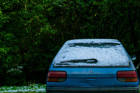 Snow coverd a car after snowing day.の写真素材