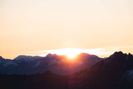 A stunning scene of sunset on the top of Alps mountain.の写真素材