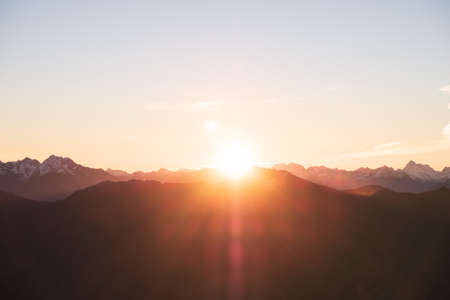 A stunning scene of sunset on the top of Alps mountain.