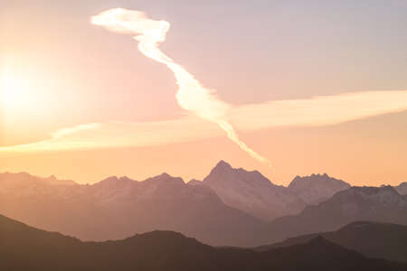 A stunning scene of sunset on the top of Alps mountain.