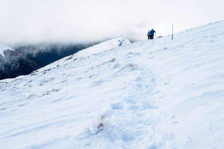 People hiking on the beautiful snow mountains. kahurangi national park, New Zealand.