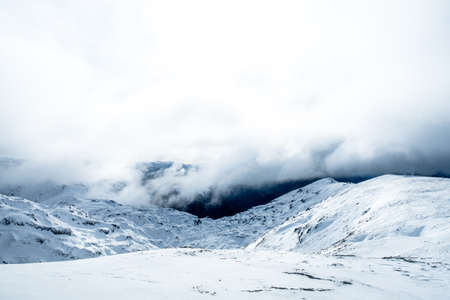 The stunning landscape of the snowy mountain on a foggy misty cloudy day. Kahurangi national park, New Zealand.の写真素材