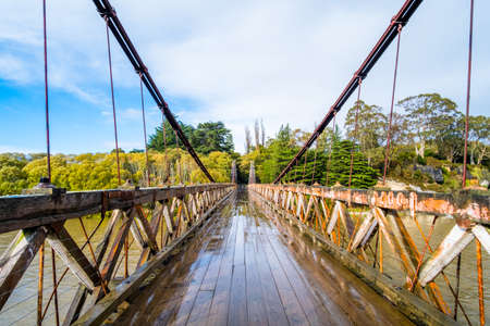 Clifden suspension bridge after a raining day. New Zealand.の写真素材
