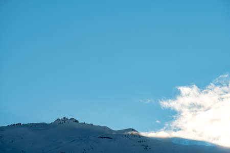 Stunning of the scenery of rocky mountain covered with snow after the raining day. Cloudy and foggy....