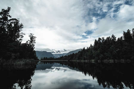 Beautiful landscape of the mountain and the reflection on the lake. Lake Matheson, Fox Glacier, New Zealand.の写真素材