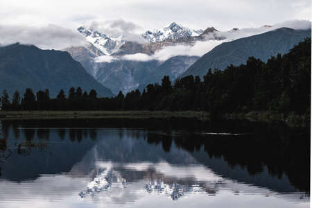 Beautiful landscape of the mountain and the reflection on the lake. Lake Matheson, Fox Glacier, New...