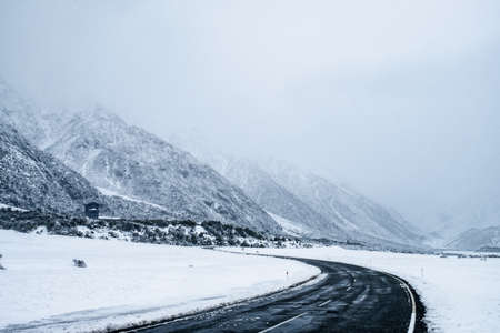 Atphalt road in the winter with foggy condition.の写真素材