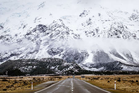 View of a road in Mount Cook Village covered with white fresh snow after a snowy day.の写真素材