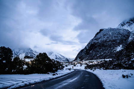 View of  Mount Cook Village covered with white snow after a snowy day at night.