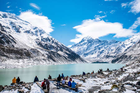 2018, Oct 13, New Zealand, Mount Cook National Park, Group of traveler enjoying with a beautiful view covered with snow after a snowy day.のeditorial素材