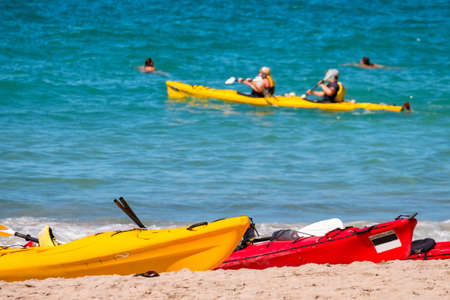 Poeple doing kayaking in the blue ocean..の写真素材