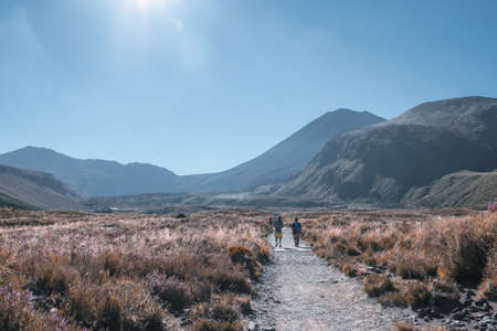 New Zealand, North Island, A group of people trekking in Beautiful Landscape of Tongariro Crossing track on a beautiful day..の写真素材