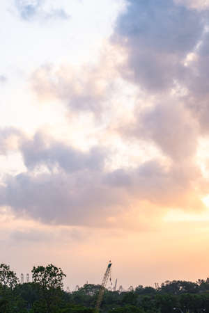 View of the beautiful sky and a crane at sunset..