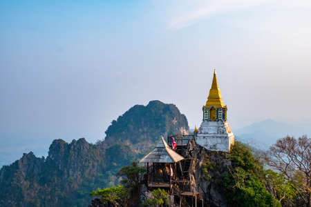 Beautiful view of the temple and stupa on the cliff. Wat Phrachomklao Rachanusorn, Lampang, Thailand.の写真素材