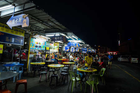 2019 May 9th, Malaysia, Perak, Ipoh, Local people are having dinner in the local food stalls at Tong Sui Kai night market.のeditorial素材