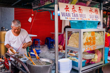 Penang, Malaysia - 2019, March 4th : Wan tan mee shop at  Chulia Street Night Hawker Stalls.のeditorial素材