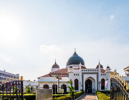 Penang, Malaysia - 2019, March 4th : View of Kapitan Keling Mosque the oldest masjid in the city. Beautiful scene at sunset with blue sky.のeditorial素材