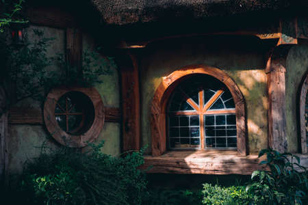 2019, February 18th, New Zealand, Matamata, Hobbiton movie set - Beautiful scenery of the garden and hobbit house (hole) in Shire.のeditorial素材