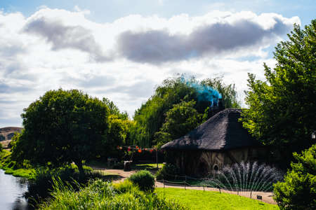 2019, February 18th, New Zealand, Matamata, Hobbiton movie set - Beautiful scenery of the garden and hobbit house (hole) in Shire.のeditorial素材
