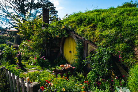 2019, February 18th, New Zealand, Matamata, Hobbiton movie set - Beautiful scenery of the garden and hobbit house (hole) in Shire. (Sam Home)のeditorial素材