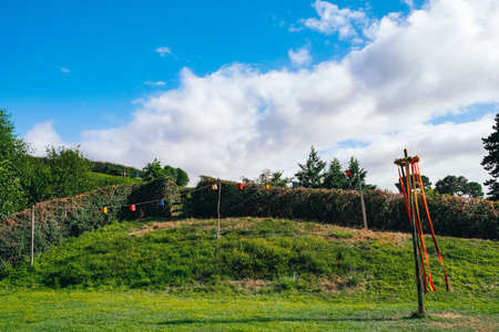 2019, February 18th, New Zealand, Matamata, Hobbiton movie set - Beautiful scenery of the garden and hobbit house (hole) in Shire. (play yard)のeditorial素材