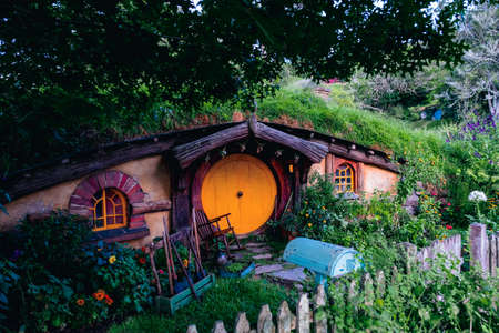 2019, February 18th, New Zealand, Matamata, Hobbiton movie set - Beautiful scenery of the garden and hobbit house (hole) in Shire.のeditorial素材