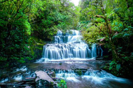 Beautiful Autumn Waterfall at Purakaunui Falls, South Island, New Zealand. Long exposure Photography.の写真素材