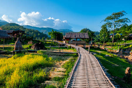 Stunning scenic landscape of the famous Boon Ko Ku So (Kho-Ku-So) bamboo bridge at Pai, Mae Hong Son, Thailand. Rice field season and sunset scene.の写真素材