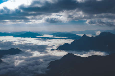 Beautiful Landscape of Phu Chi Fa, Chiang Rai, Thailand. Morning light with sea clouds and fog. Dramatical photo style.の写真素材