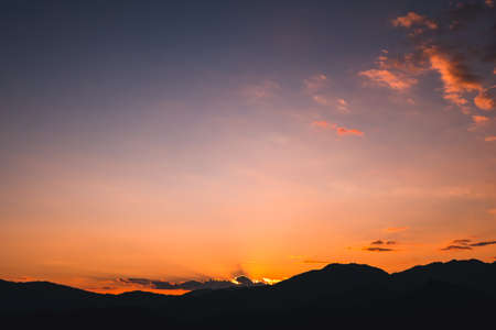 Sunset scene over the mountain., Orange, pink and purple color.の写真素材