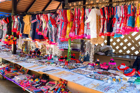 Hill tribe clothes with colorful and beautiful texture hanging on the shop in the marketの写真素材