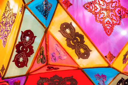 Beautiful Northern Thai style colorful lantern hanging on the street during the Loy Krathong festival.の写真素材