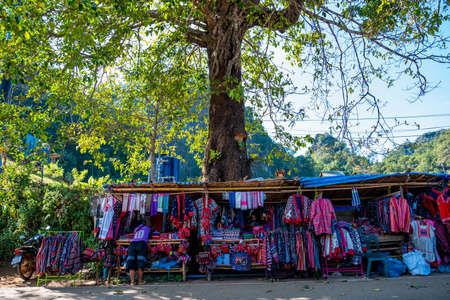 2019, Nov 22, Mae Hong Son, Thailand - Hill tribe clothes with colorful and beautiful texture hanging on the shop in the marketのeditorial素材