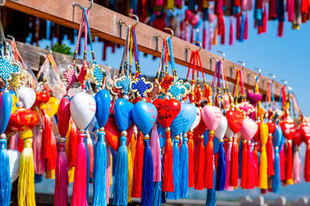 2019, November 21st, Pai, Mae hong son, Thailand. A lot of Chinese style amulets hanging on the wooden shrine. use for making wishes for love and life.のeditorial素材