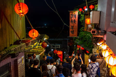 The scene that crowded with people at A-MEI Teahouse, The famous shop decorate with red Chinese traditional lantern, Jiufen, New Taipei, Taiwan. 2nd October 2019.のeditorial素材