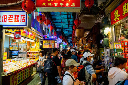 The scene crowded with people in the market at Jiufen walking street, New Taipei, Taiwan. 2nd October 2019.のeditorial素材